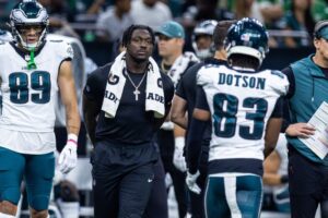 Sep 22, 2024; New Orleans, Louisiana, USA; Philadelphia Eagles wide receiver A.J. Brown (11) in street clothes due to injury looks on against the New Orleans Saints during the first half at Caesars Superdome. Mandatory Credit: Stephen Lew-Imagn Images
