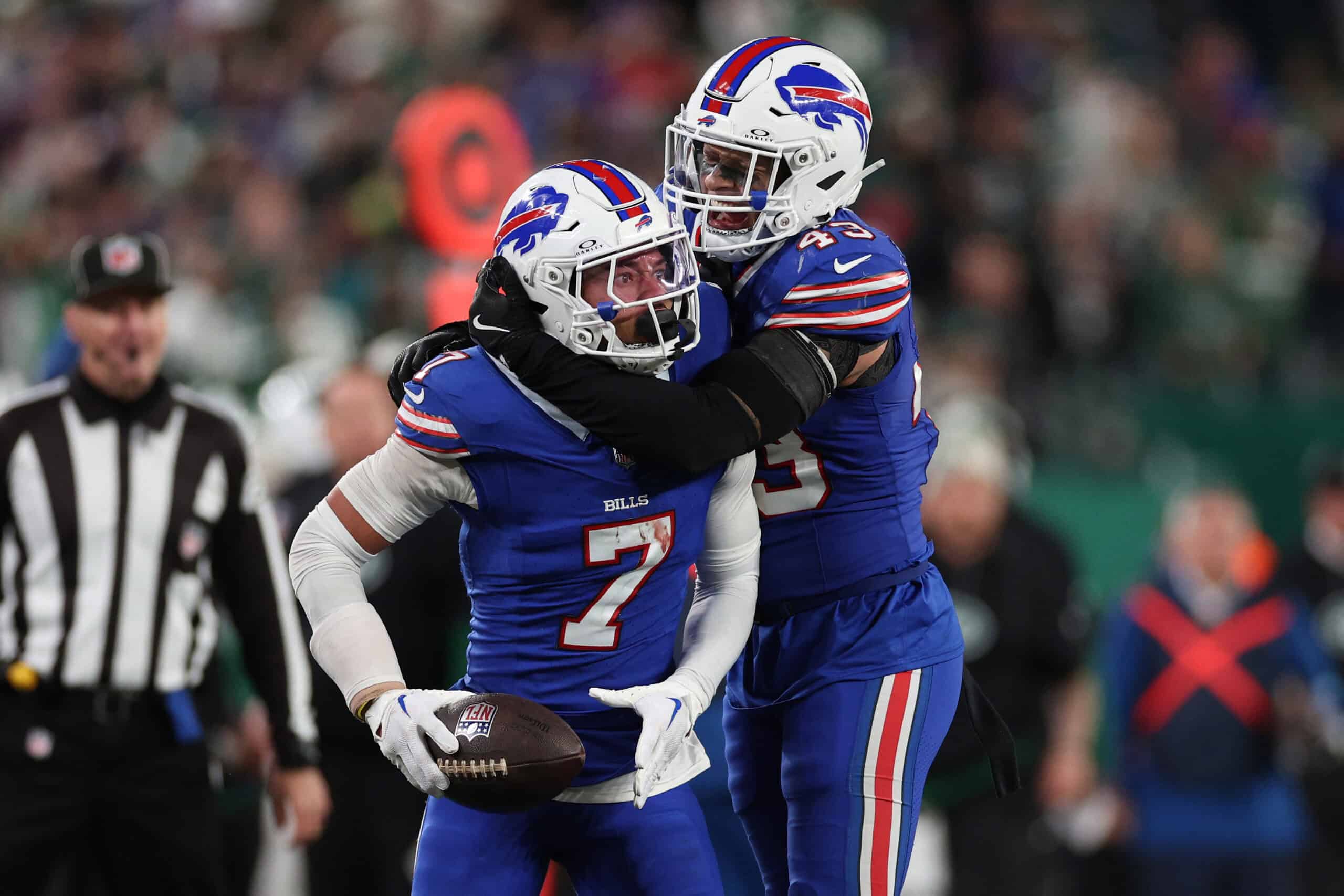 EAST RUTHERFORD, NEW JERSEY - OCTOBER 14: Taron Johnson #7 of the Buffalo Bills celebrates an interception with Terrel Bernard #43 during the fourth quarter against the New York Jets at MetLife Stadium on October 14, 2024 in East Rutherford, New Jersey.