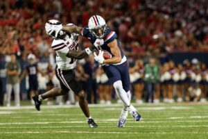 Tetairoa McMillan is in the conversation for WR1 in the 2025 NFL Draft. We take a look at his player comps, Mock Draft projection, and more.