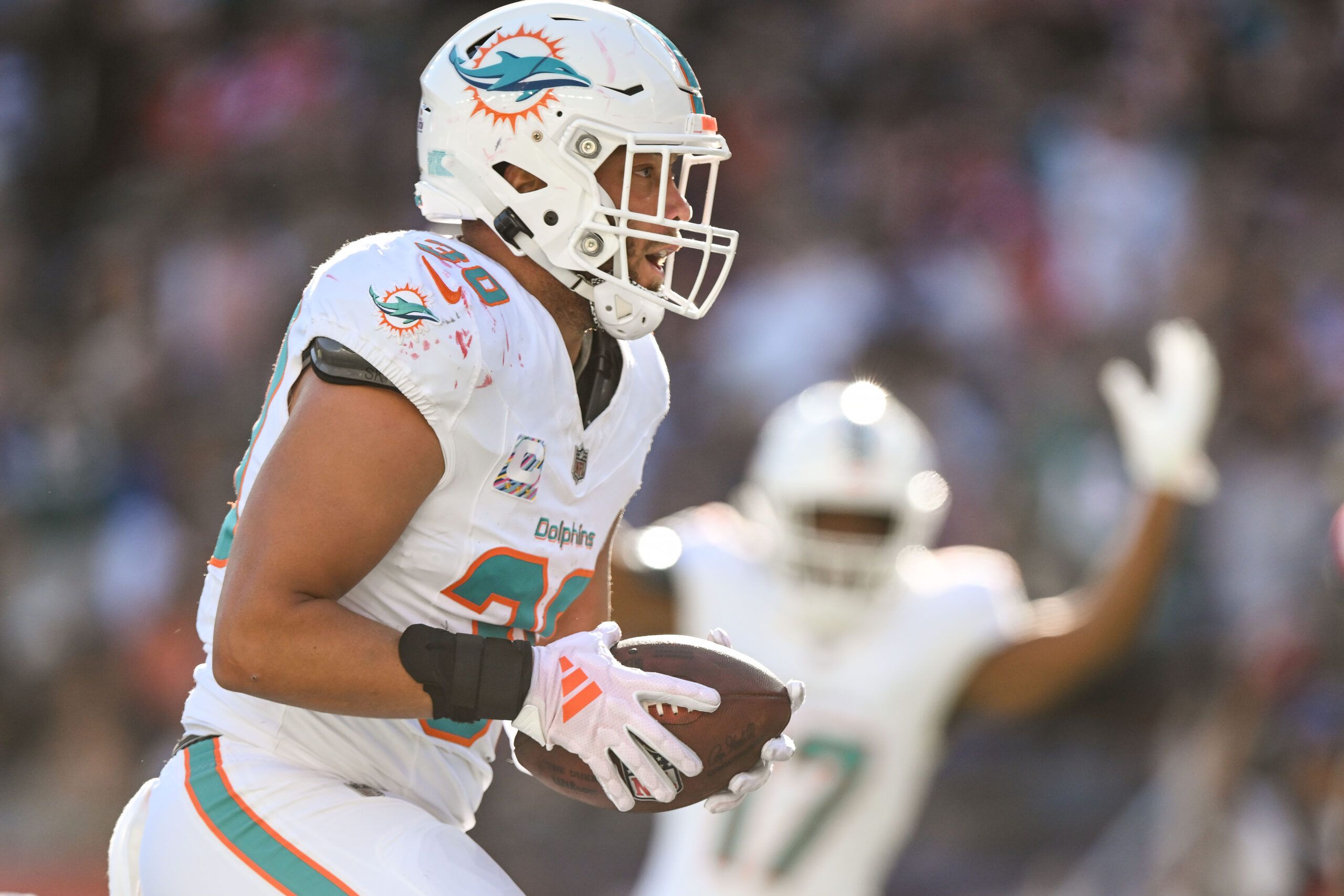 Oct 6, 2024; Foxborough, Massachusetts, USA; Miami Dolphins fullback Alec Ingold (30) scores a touchdown against the New England Patriots during the second half at Gillette Stadium. Mandatory Credit: Brian Fluharty-Imagn Images
