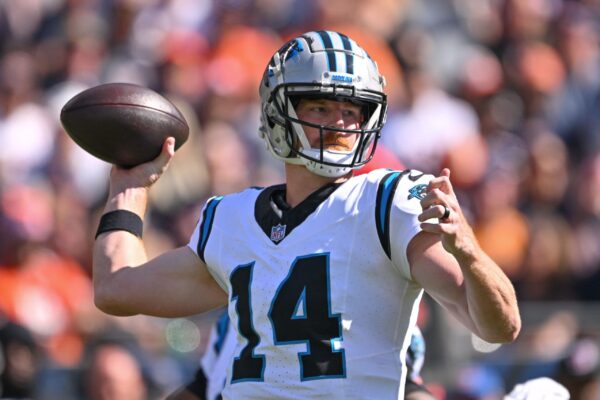 Oct 6, 2024; Chicago, Illinois, USA; Carolina Panthers quarterback Andy Dalton (14) passes the ball against the Chicago Bears during the second quarter at Soldier Field. Mandatory Credit: Daniel Bartel-Imagn Images