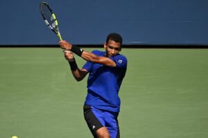 Felix Auger-Aliassime follows through on a backhand. He lost in Antwerp to Robert Bautista Agut on Friday.