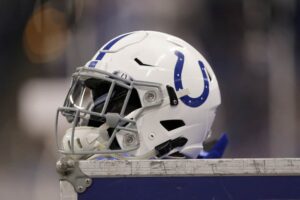 A Indianapolis Colts helmet sits on top of a equipment locker during the NFL game between the Miami Dolphins and Indianapolis Colts on November 25, 2018, at Lucas Oil Stadium in Indianapolis, IN.