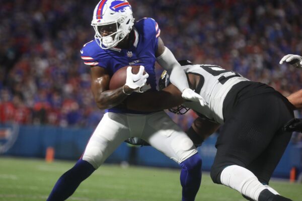 Bills Curtis Samuel runs with the ball and tries to shake off a Jaguars defensive player during first half action at Highmark Stadium in Orchard Park on Sept. 23, 2024.
