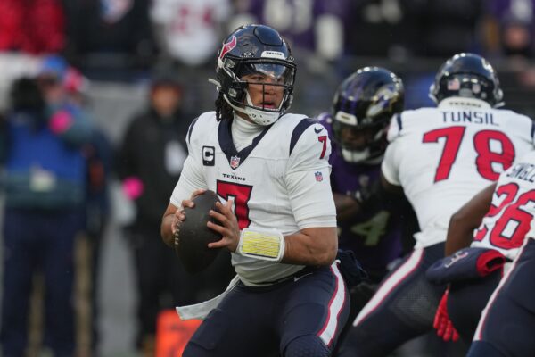 Houston Texans quarterback C.J. Stroud (7) drops back to pass against the Baltimore Ravens in the first half of a 2024 AFC divisional round game at M&T Bank Stadium. Mandatory Credit: Mitch Stringer-USA TODAY Sports