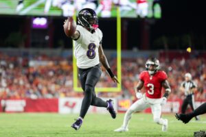 Baltimore Ravens quarterback Lamar Jackson (8) runs with the ball against the Tampa Bay Buccaneers in the second quarter at Raymond James Stadium.
