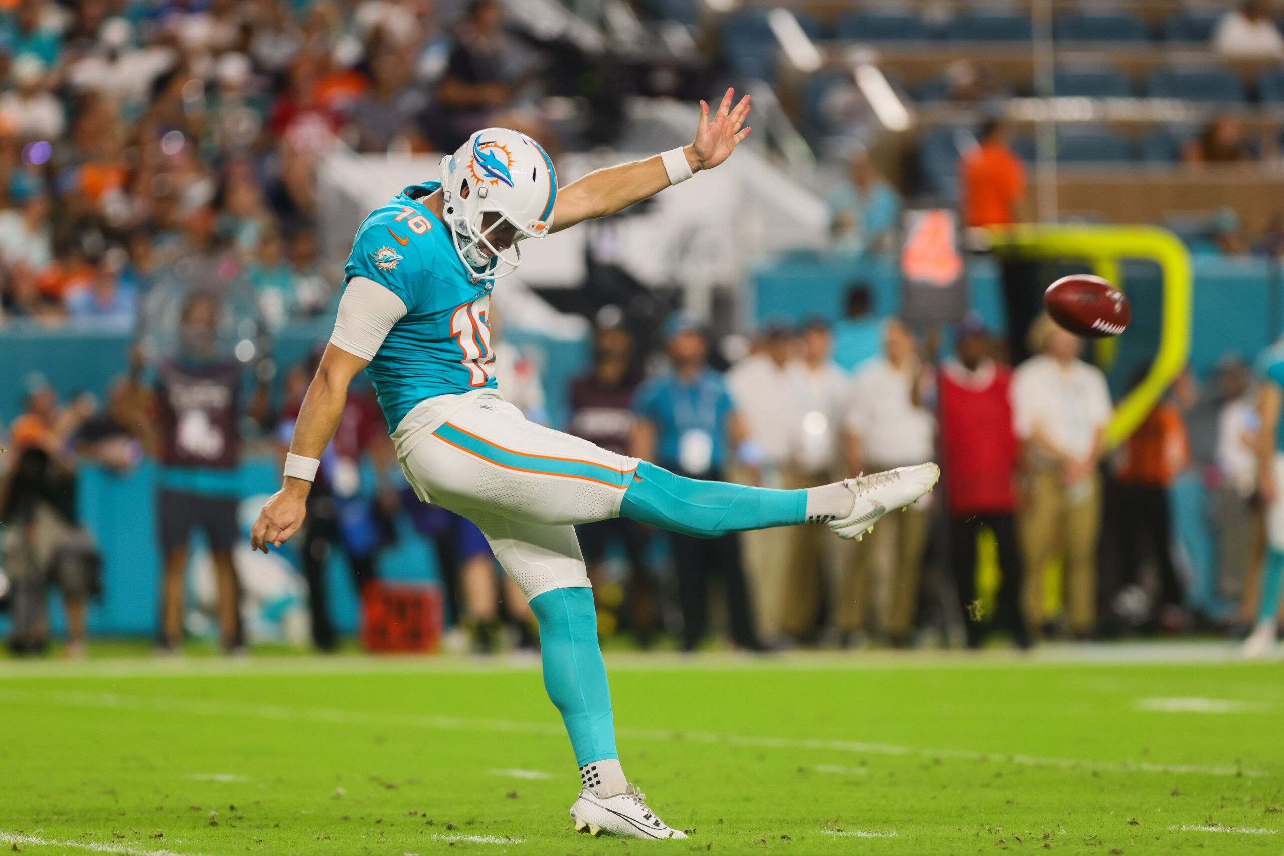 Sep 30, 2024; Miami Gardens, Florida, USA; Miami Dolphins punter Jake Bailey (16) punts against the Tennessee Titans during the third quarter at Hard Rock Stadium. Mandatory Credit: Sam Navarro-Imagn Images