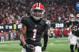 Atlanta Falcons wide receiver Darnell Mooney (1) reacts after scoring a touchdown against the Tampa Bay Buccaneers during the second half at Mercedes-Benz Stadium.