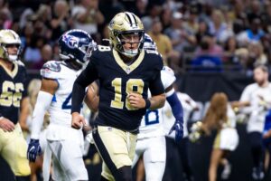 Aug 25, 2024; New Orleans, Louisiana, USA; New Orleans Saints quarterback Spencer Rattler (18) reacts to passing a touchdown against the Tennessee Titans during the first half at Caesars Superdome. Mandatory Credit: Stephen Lew-USA TODAY Sports