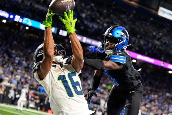 Detroit Lions cornerback Terrion Arnold (0) breaks a pass intended for Seattle Seahawks wide receiver Tyler Lockett (16) during the second half at Ford Field in Detroit on Monday, Sept. 30, 2024.