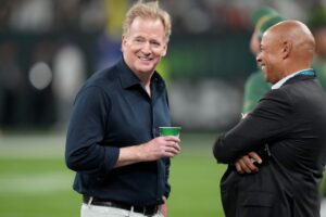Sep 6, 2024; Sao Paulo, BRA; NFL commissioner Roger Goodell talks to NFL Players Association executive director Lloyd Howell before a game in Brazil between the Green Bay Packers and Philadelphia Eagles at Neo Quimica Arena. Mandatory Credit: Kirby Lee-Imagn Images
