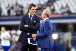 Sep 15, 2024; Arlington, Texas, USA; Fox Sports commentator Tom Brady speaks with Tom Rinaldi before the game between the Dallas Cowboys and New Orleans Saints at AT&T Stadium. Mandatory Credit: Kevin Jairaj-Imagn Images