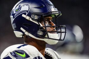 Seattle Seahawks quarterback Geno Smith (7) looks at the scoreboard after the Detroit Lions scored a touchdown during the N.F.L. game against the Seattle Seahawks at Ford Field in Detroit, Tuesday, Oct. 1, 2024.