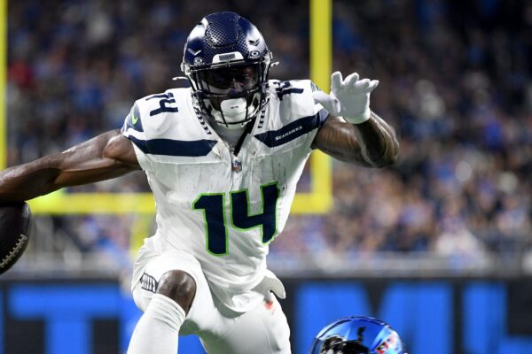 Sep 30, 2024; Detroit, Michigan, USA; Seattle Seahawks wide receiver DK Metcalf (14) leaps with the ball against the Detroit Lions in the second quarter at Ford Field. Mandatory Credit: Eamon Horwedel-Imagn Images