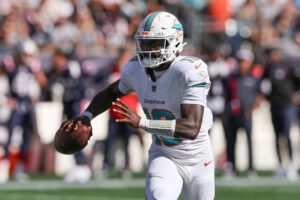 Oct 6, 2024; Foxborough, Massachusetts, USA; Miami Dolphins quarterback Tyler Huntley (18) throws the ball during the first half against the New England Patriots at Gillette Stadium. Mandatory Credit: Paul Rutherford-Imagn Images