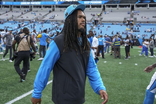 Carolina Panthers running back Jonathon Brooks (24) walks off the field after the second half against the Los Angeles Chargers at Bank of America Stadium.