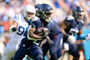 Tennessee Titans running back Tyjae Spears (2) runs the ball against the Indianapolis Colts during the first half at Nissan Stadium.